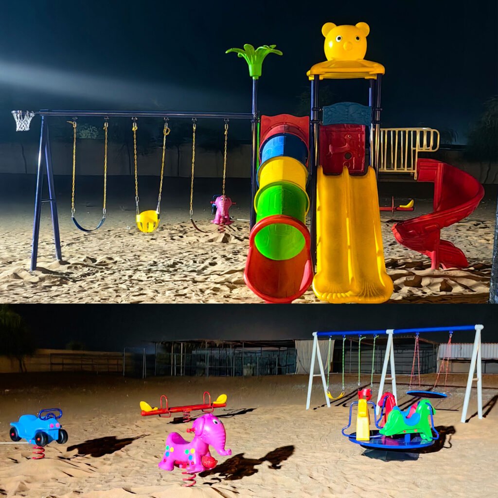 Outdoor playground case study on sandy terrain with slides, swings, and spring riders.